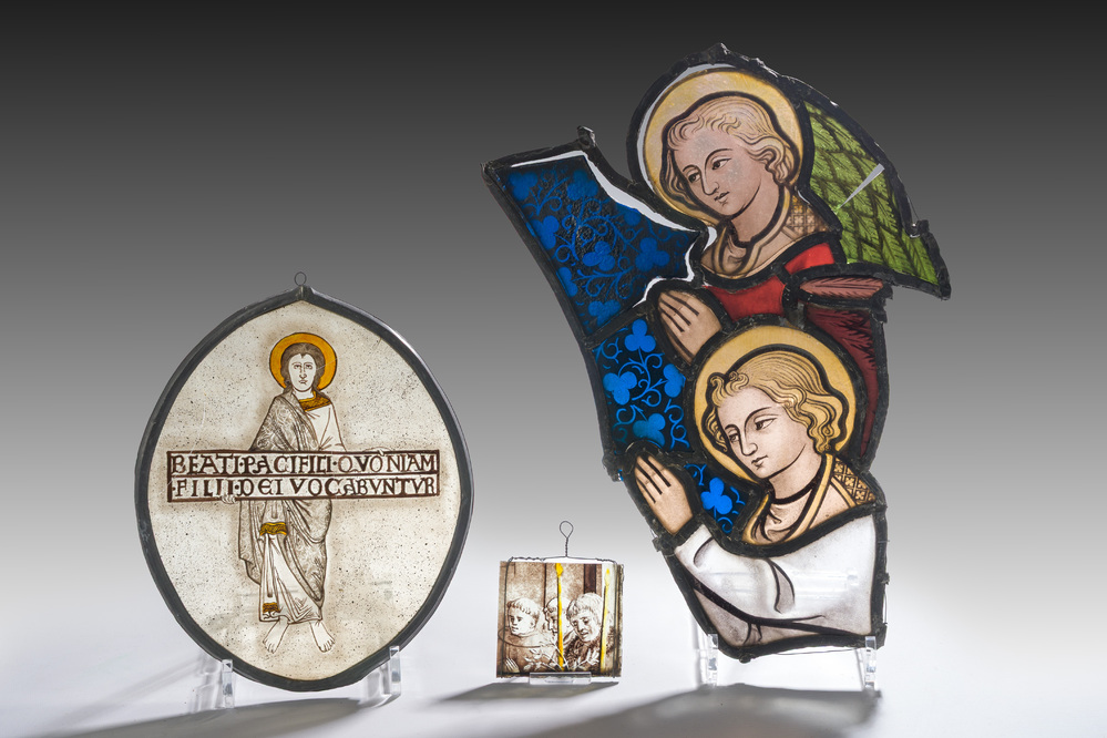 Three Gothic Revival painted and stained glass fragments, 19th C.