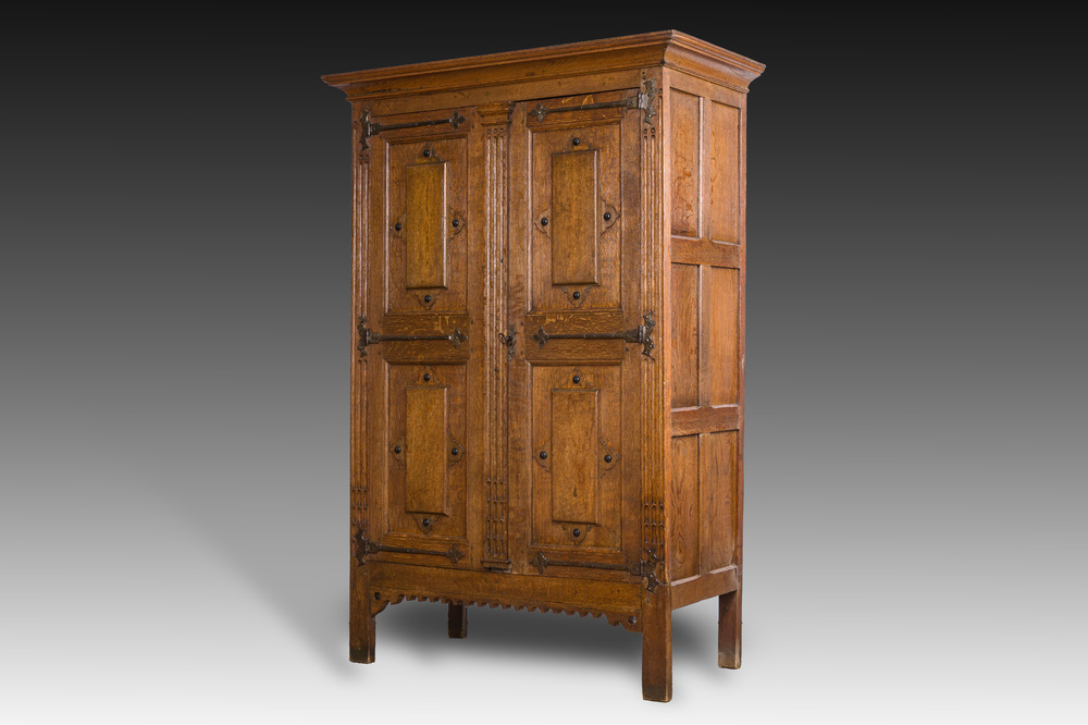 A Flemish oak two door cupboard with cast iron hinges, 17th C.