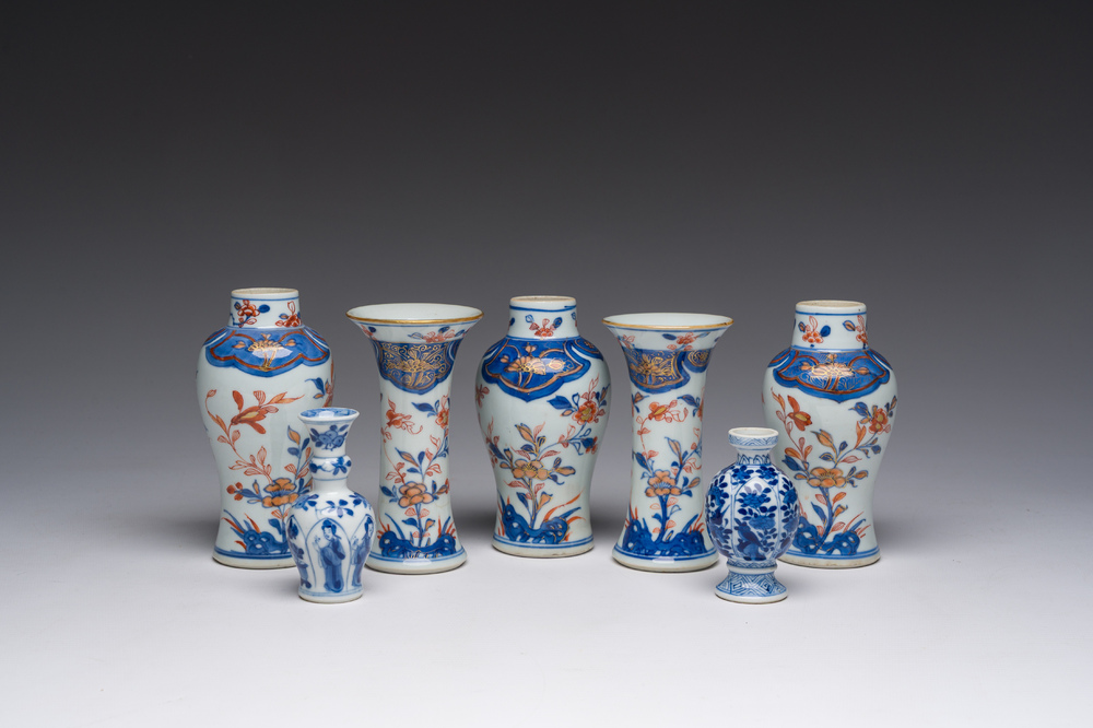 A Chinese Imari style five-piece miniature garniture and two blue and white vases with floral design, Kangxi