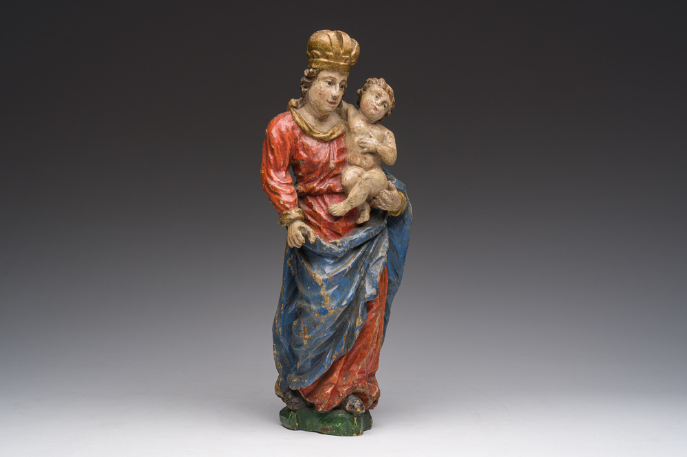 A Flemish polychromed wooden sculpture of The Madonna with Child, 18th C.