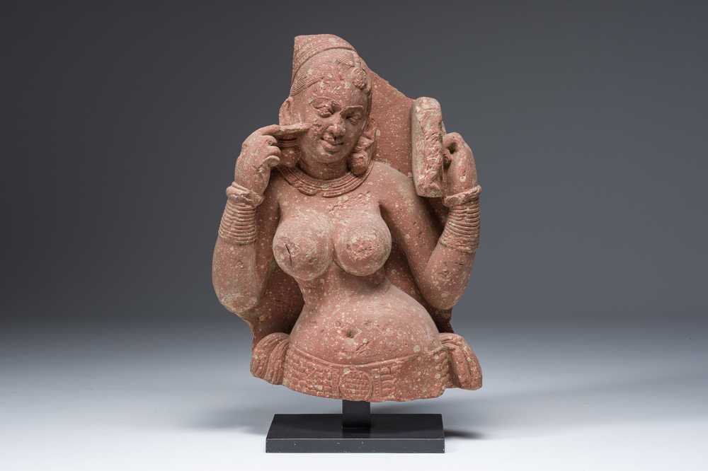 An Indian yellow-speckled red sandstone relief of a devata, probably Mathura school, Kushan period 2nd C. b.C./2nd C.