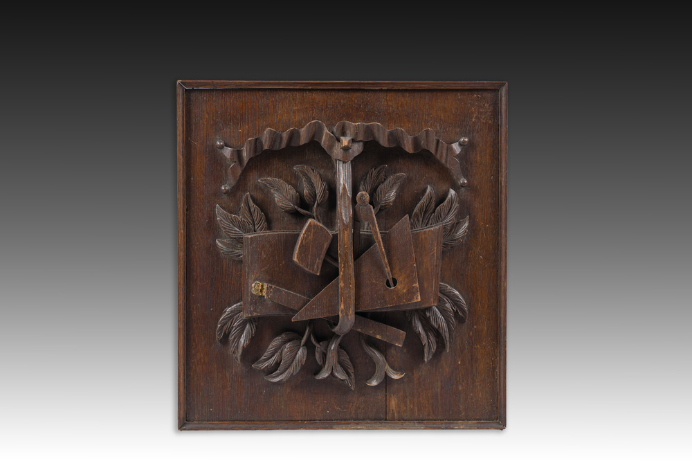 A Belgian carved wooden mason's panel with building tools, first half 20th C.