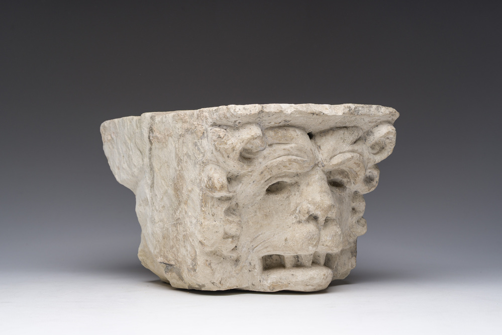 An architectural limestone fragment with a lion's head, probably 16th C.
