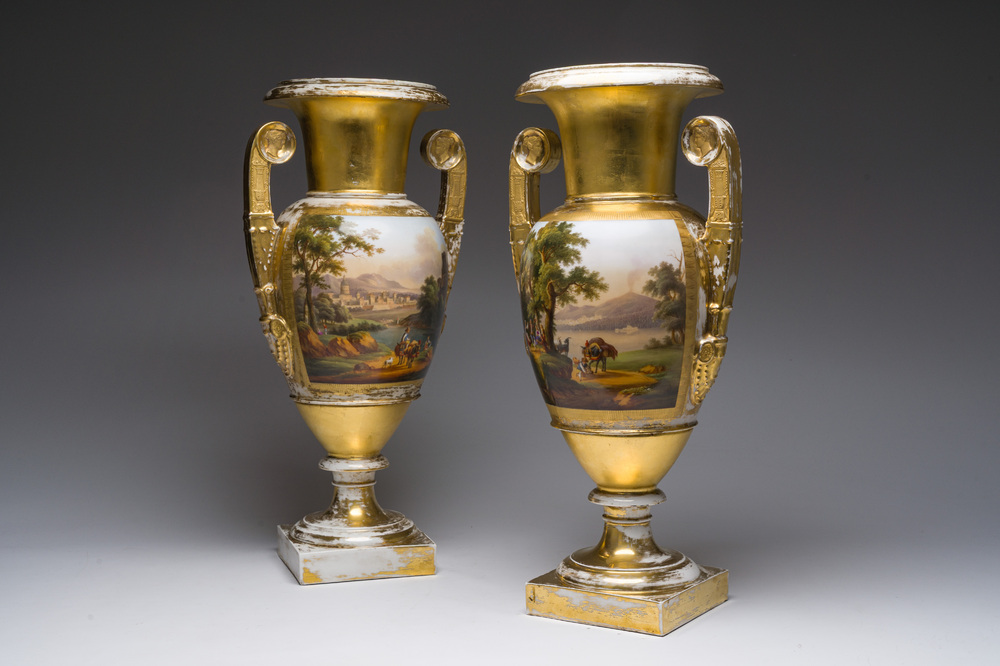 A pair of fine gilt and polychrome Paris porcelain 'animated landscapes' Empire vases, first half 19th C.