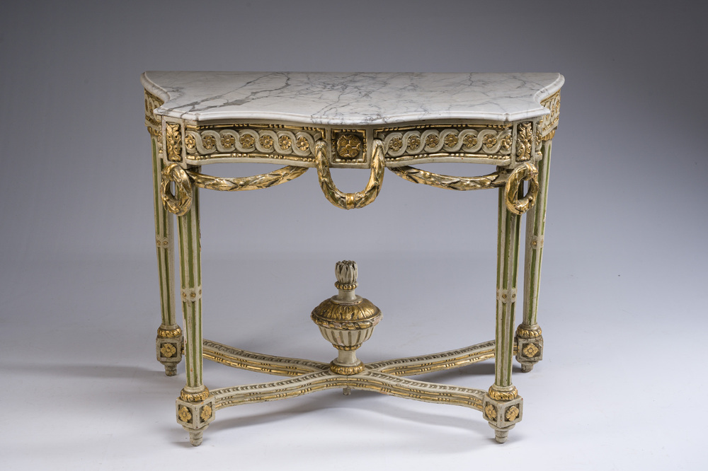A parcel-gilt and polychromed wooden marble-topped console table in Louis XVI style, 19th C.