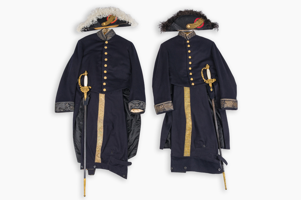 Two Belgian ceremonial costumes with bicorn hats and sables, 19th/20th C.
