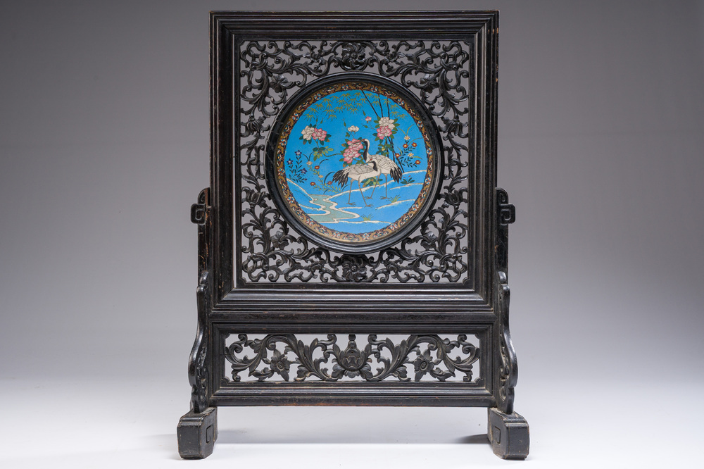 A reticulated Chinese wooden table screen with a Japanese cloisonn&eacute; dish, 19th C.