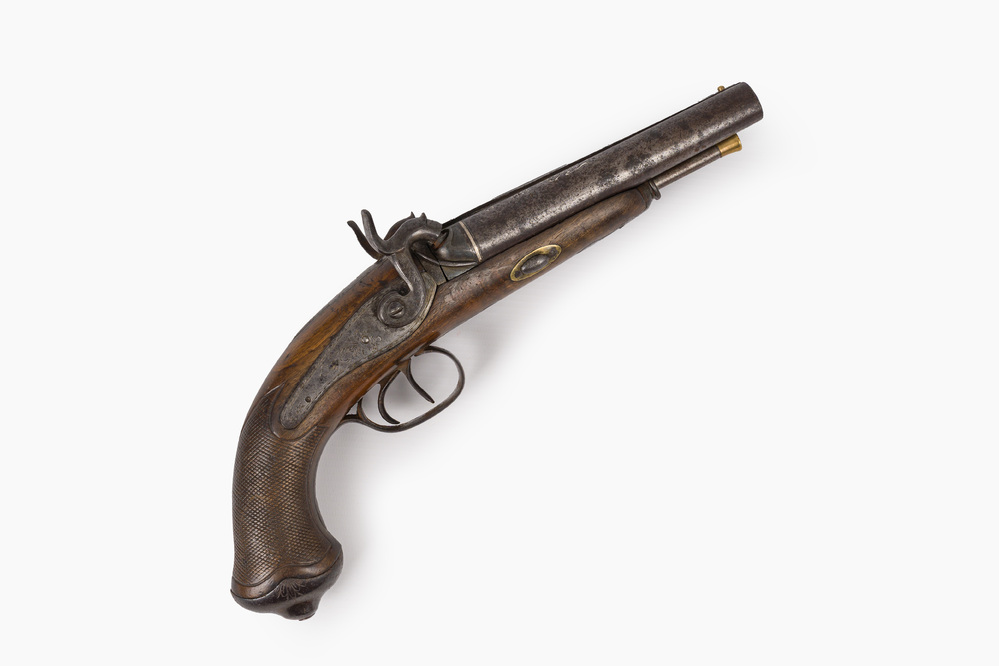 A Spanish silver-inlaid two-barrelled percussion pistol with walnut gunstock, marked ''Fabricado por Blas Trevi&ntilde;o en Eibar', dated 1858