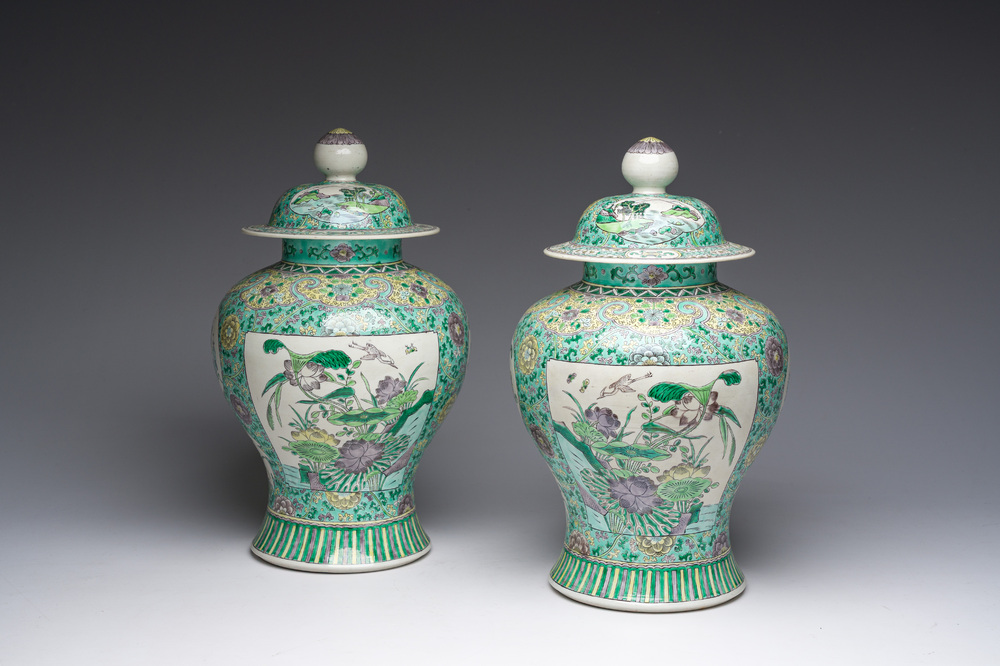 A pair of Chinese verte biscuit vases and covers with landscapes and floral design, 19th C.