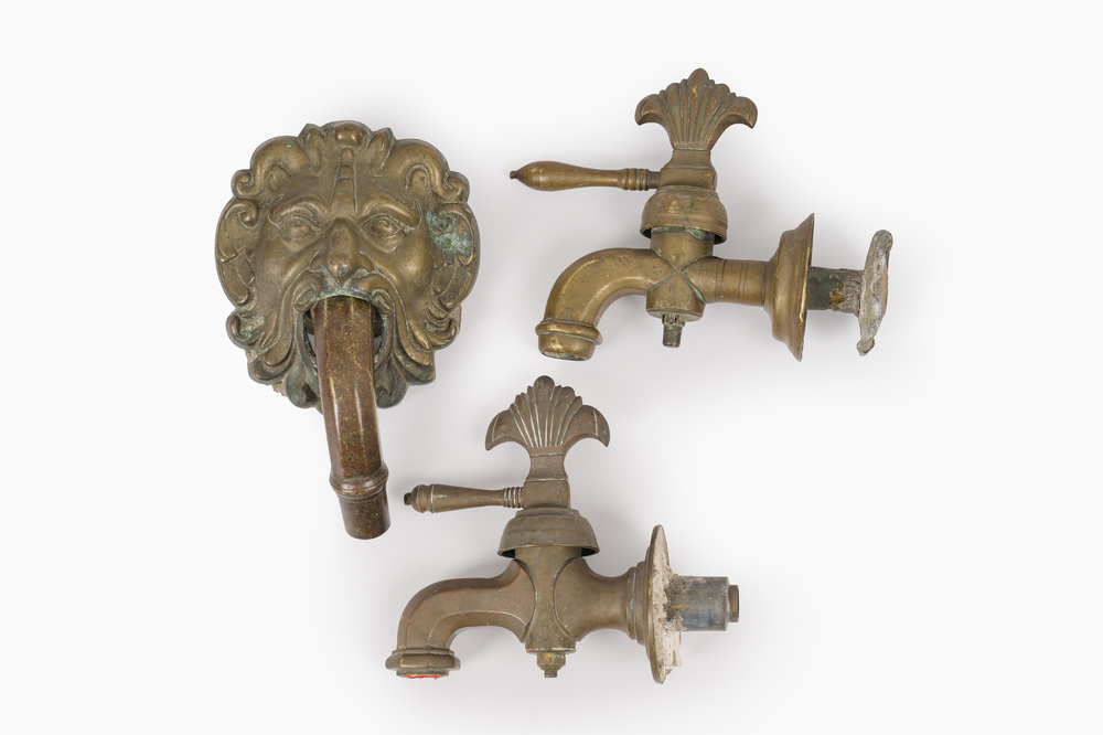 A grotesque bronze fountain mouth and two taps, probably Italy, 17th C.
