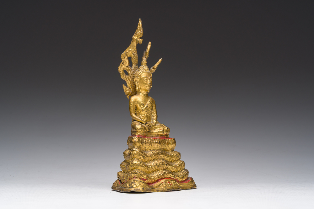 A Thai gilt bronze figure of Buddha seated on the Naga throne, Rattanakosin, 19th C.