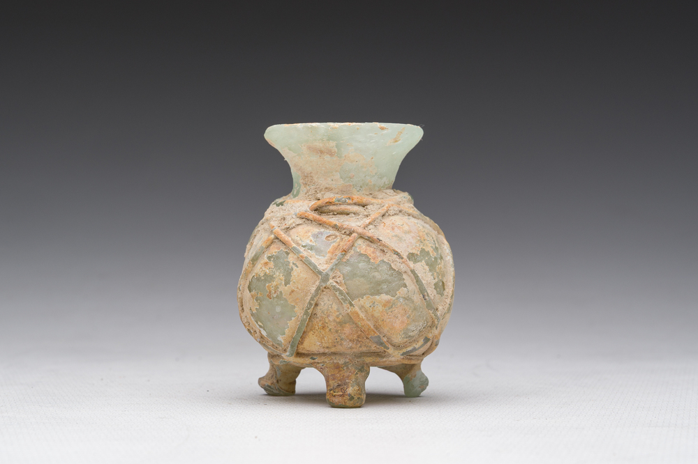 A Roman peel green glass tripod amphoriskos, Eastern Roman Empire, 5th C.