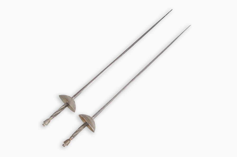 A pair of Belgian decorative &eacute;p&eacute;es with twisted handles and engraved floral design on the occasion of the fencing gala in Beauraing, dated 1899