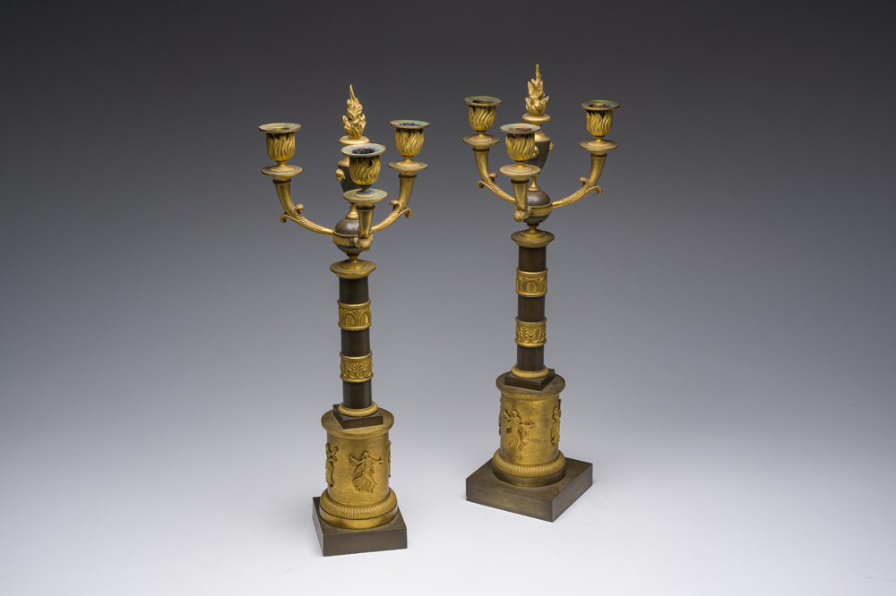A pair of French Empire gilt and patinated bronze three-light candelabre, 19th C.