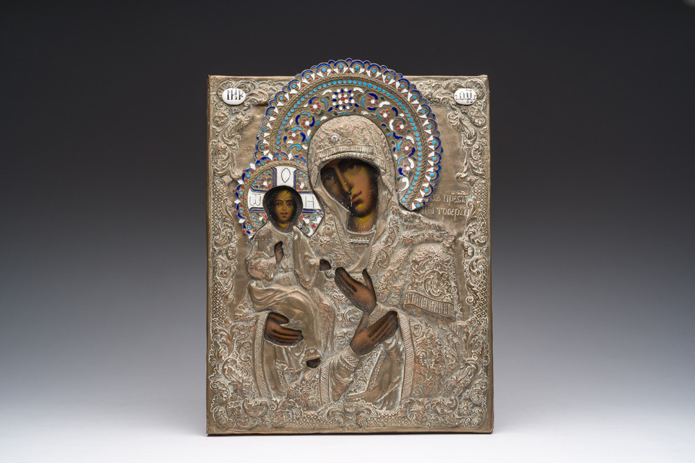 A Russian orthodox 'Virgin Mary Tricherousa (the three-handed)' icon with partly enamelled brass oklad or riza, 19th C.