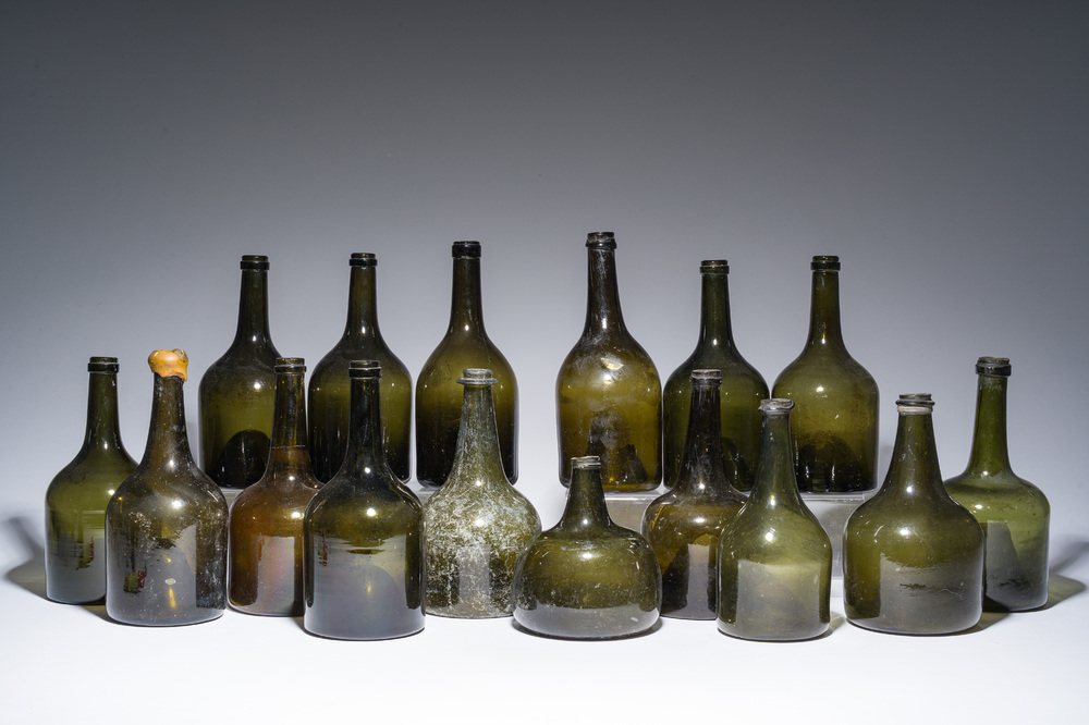 Sixteen Dutch and Flemish green glass wine bottles, 17th/19th C.