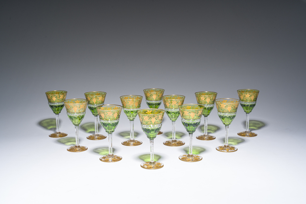 Twelve partly green-coloured overlay crystal cut white wine glasses with gilt grape design, model 'Pampre d'or', Val Saint Lambert, 20th C.