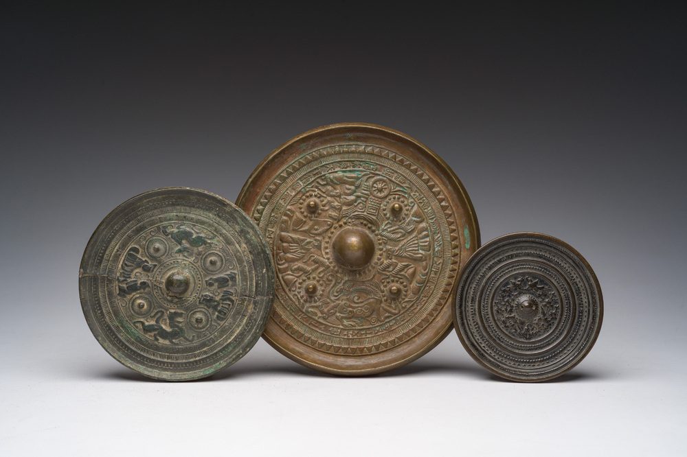 Three Chinese bronze mirrors with relief design, Qing