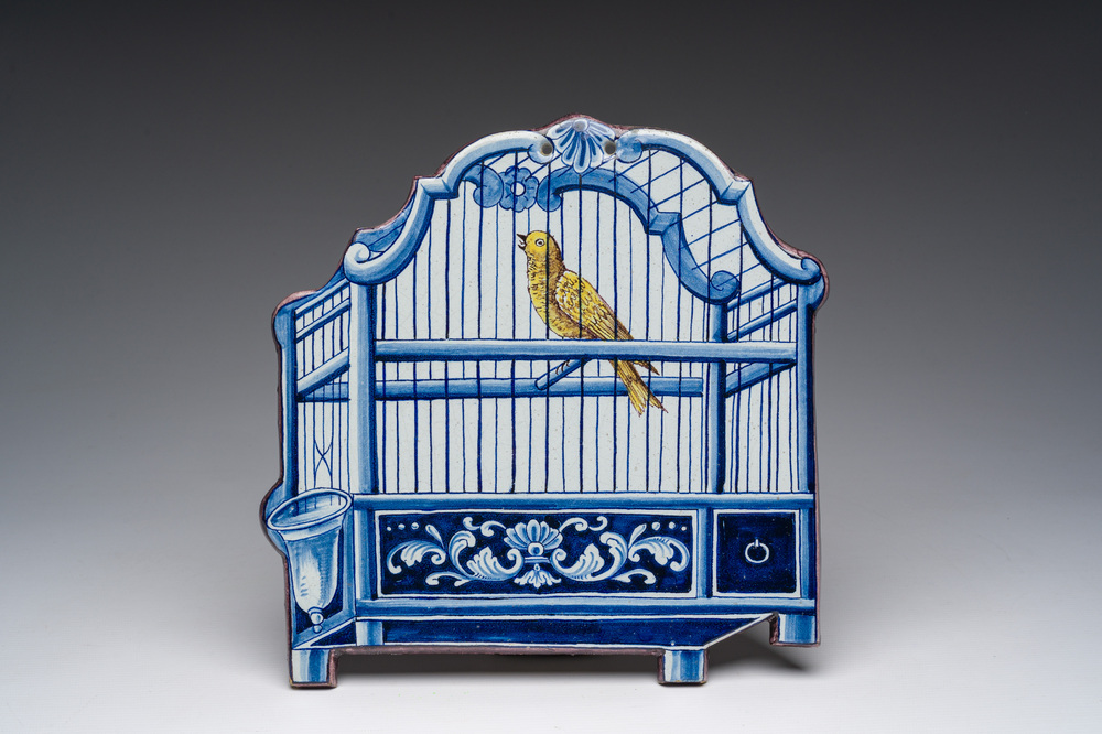 A polychrome Delftware birdcage plaque, Tichelaar, Makkum, Friesland, 19th C.