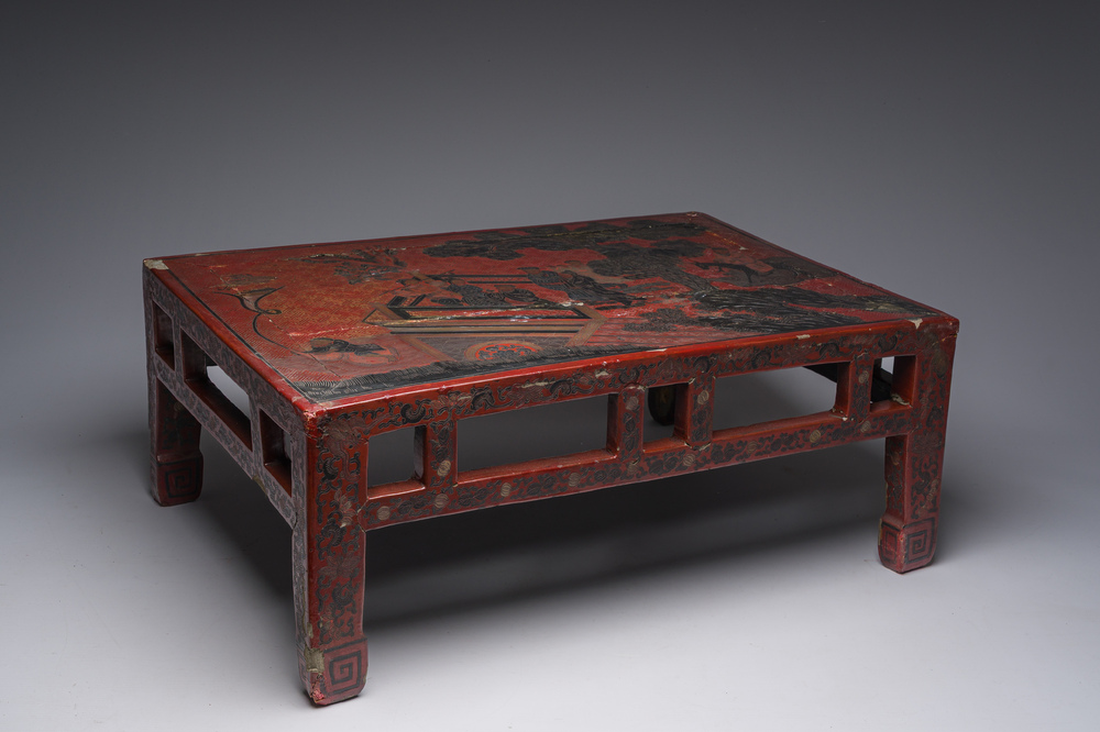 A Chinese rectangular lacquered wooden low table with figures in a garden, 19th/20th C.