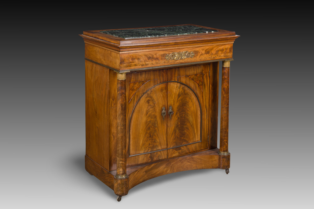A French Empire style gilt bronze mounted two-door mahogany cabinet with a green marble top, 19th C.