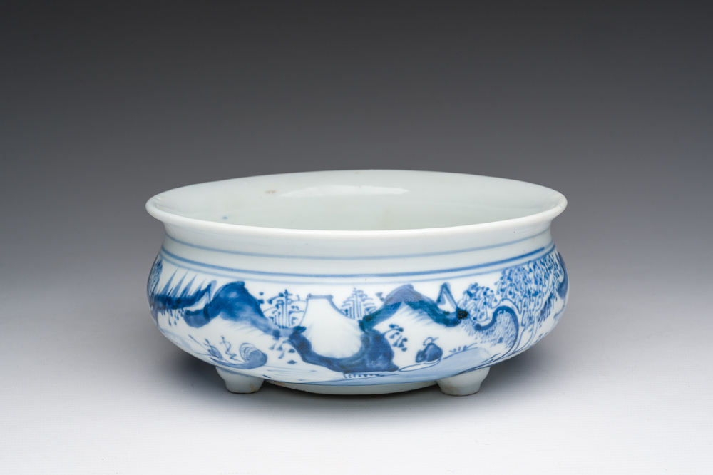 A Chinese blue and white tripod censer with figures in a landscape, 19th C.