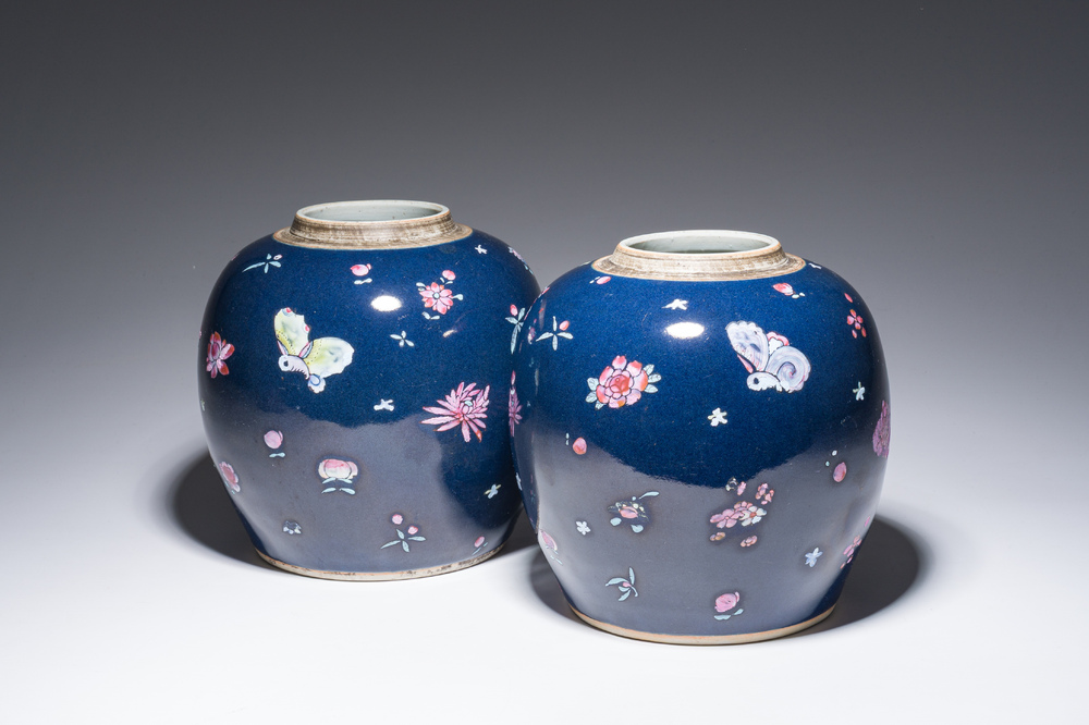 A pair of Chinese blue ground jars with enamelled decoration of butterflies and flowers, 19th C.