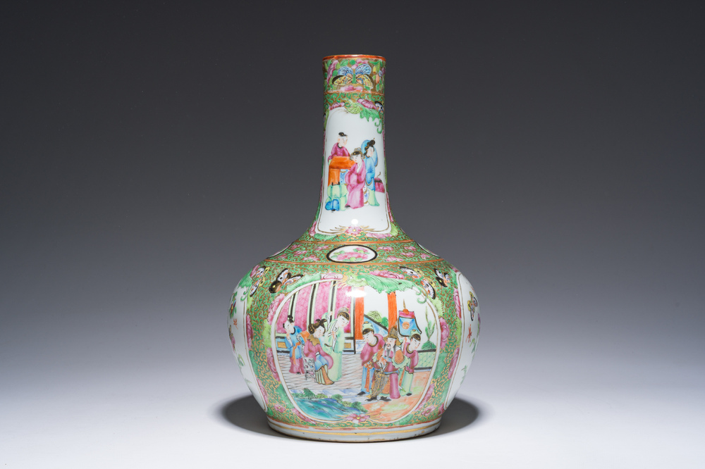 A Chinese bottle-shaped Canton famille rose vase with palace scenes and birds and butterflies among blossoming branches, 19th C.