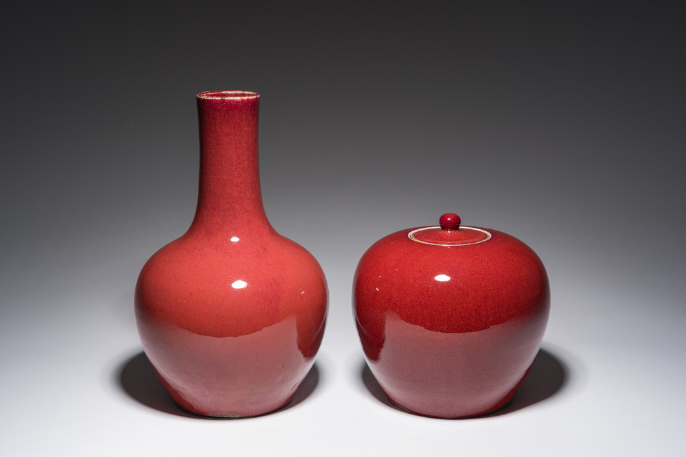 A Chinese monochrome oxblood-glazed bottle vase and a jar and cover, 19th C.