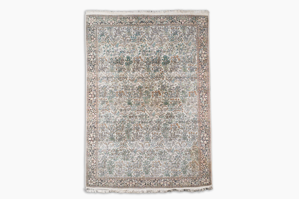 An Indian silk Kashmir rug with floral design, 20th C.
