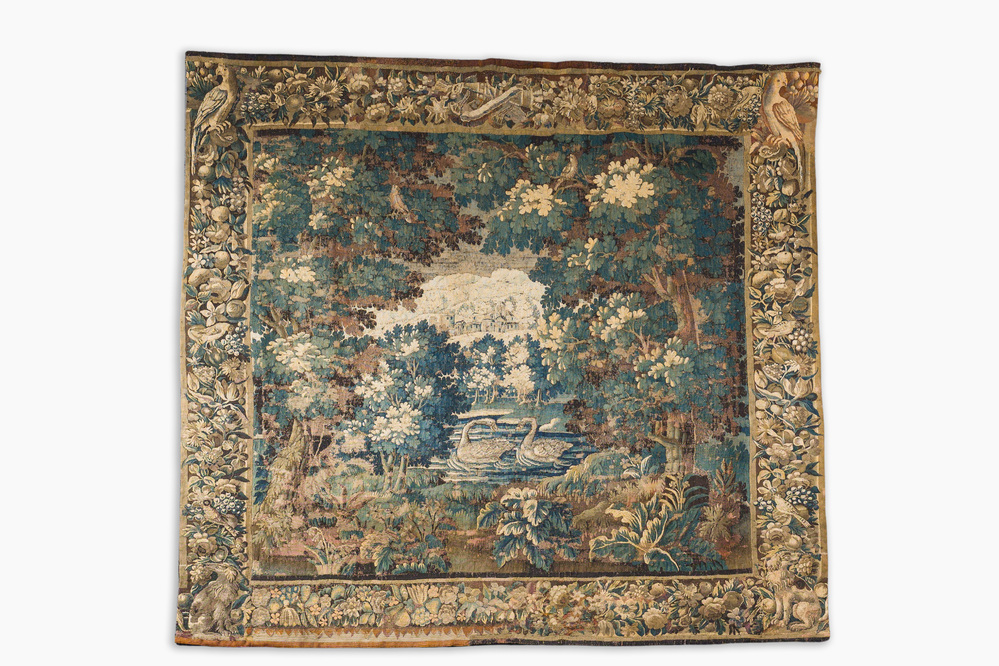A Flemish verdure wall tapestry with two swans in a lake, probably Oudenaarde, late 17th C.