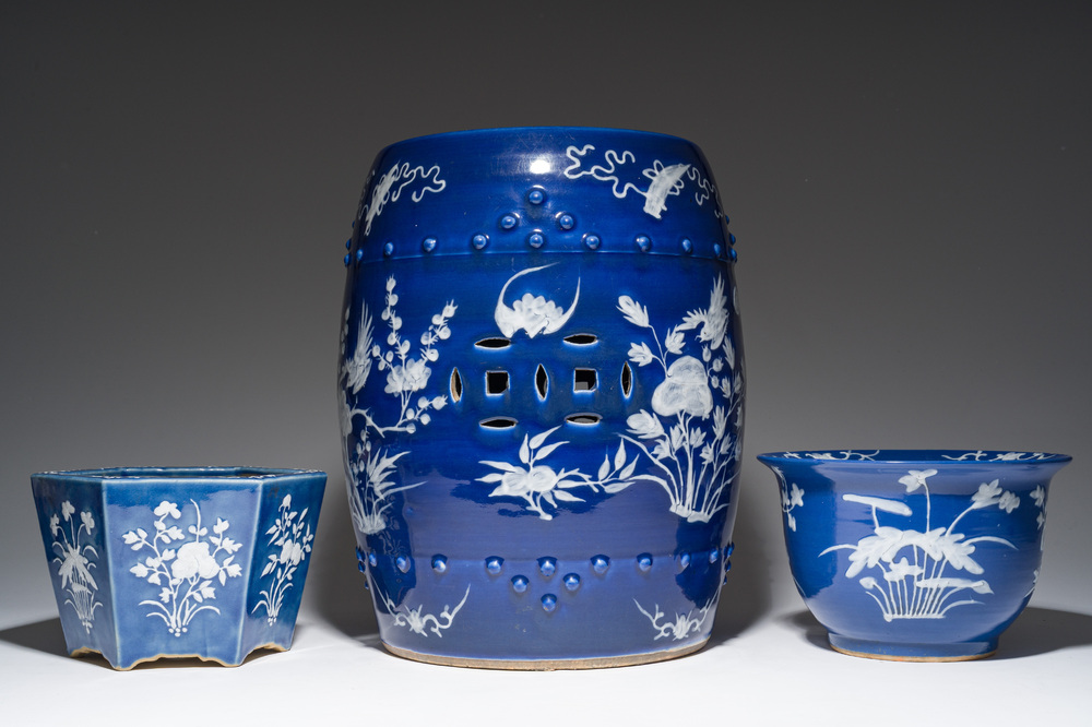 A Chinese white-slip-decorated blue-ground garden seat and two jardini&egrave;res, 19th C.