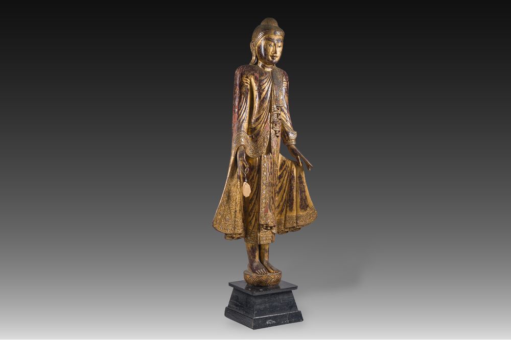 A tall Thai inlaid gilt lacquered wooden figure of a standing Buddha, 19th/20th C.