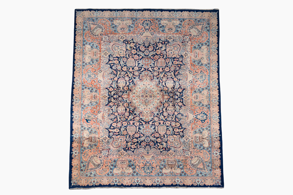 A Persian Kashmir rug with central medallion and flower vases, wool on cotton, 20th C.