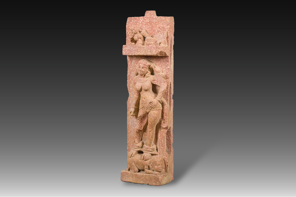 A large Indian red sandstone stupa pillar with a devata shown as a woman and lotus flowers, probably Matura region, ca. 2nd C. b.C - 2nd C.