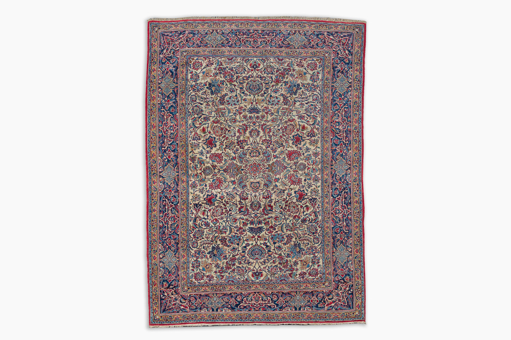 A Persian Isfahan rug with floral design, wool on silk, first half 20th C.