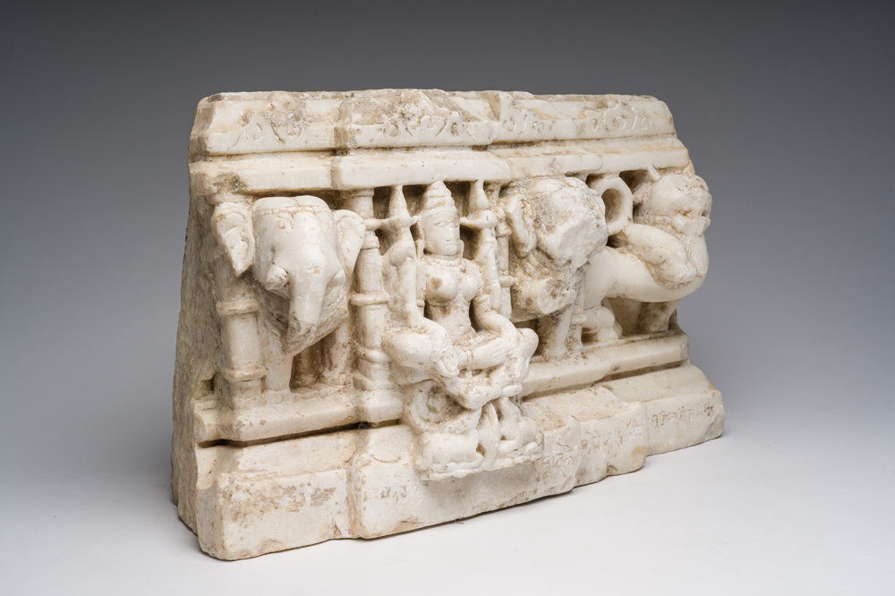 An Indian white marble Jain temple sculpture fragment with Jina flanked by elephants and a mythical lion, probably Gujarat, 15th/16th C.