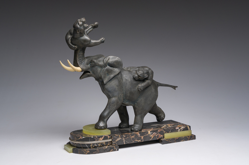 Illegibly signed: An elephant attacked by two tigers, zamak on a marble and onyx base, second quarter 20th C.