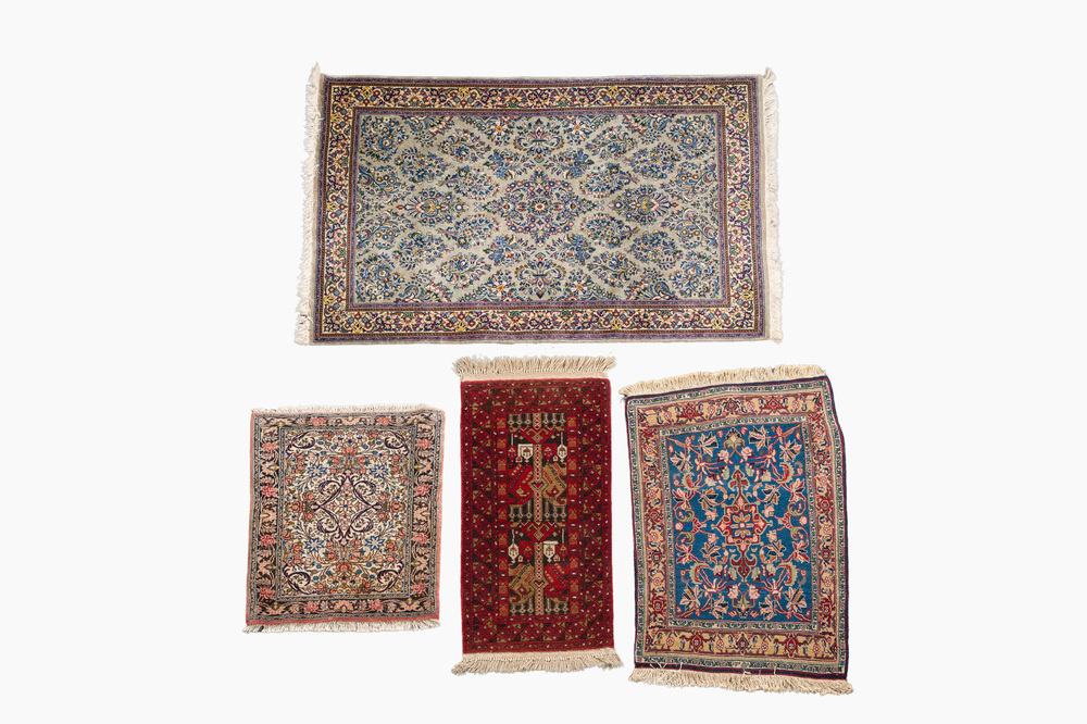 Four oriental rugs (Sarouk, Hamadan and an Afghan carpet), wool on cotton, 20th C.