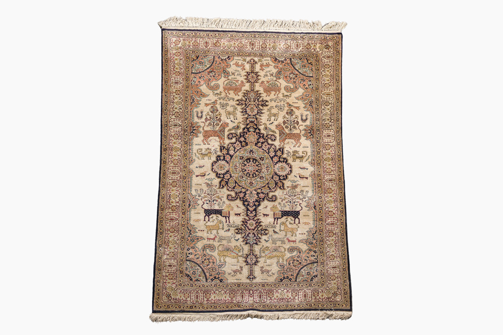 A Persian Qom (Qum/Ghom) silk rug with animals and floral design, 20th C.