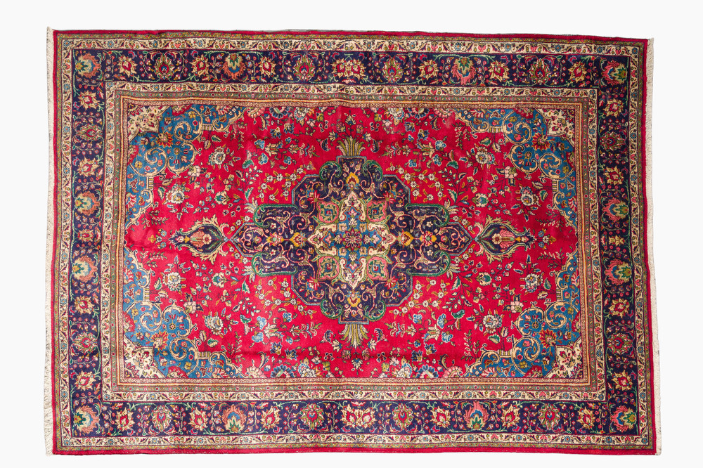 A Persian Mashad rug with central medallion and floral design, wool on cotton, 20th C.