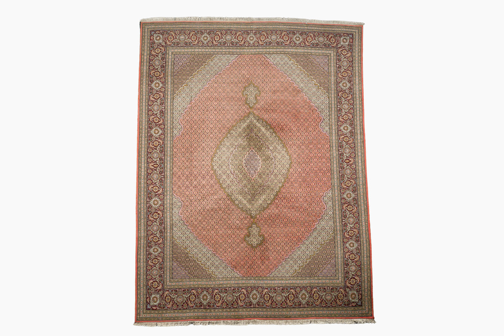 A Persian Tabriz rug with central medallion and floral design, wool on cotton, first half 20th C.