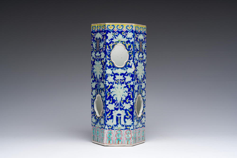 A Chinese reticulated hexagonal blue ground famille rose hatstand, 19th C.
