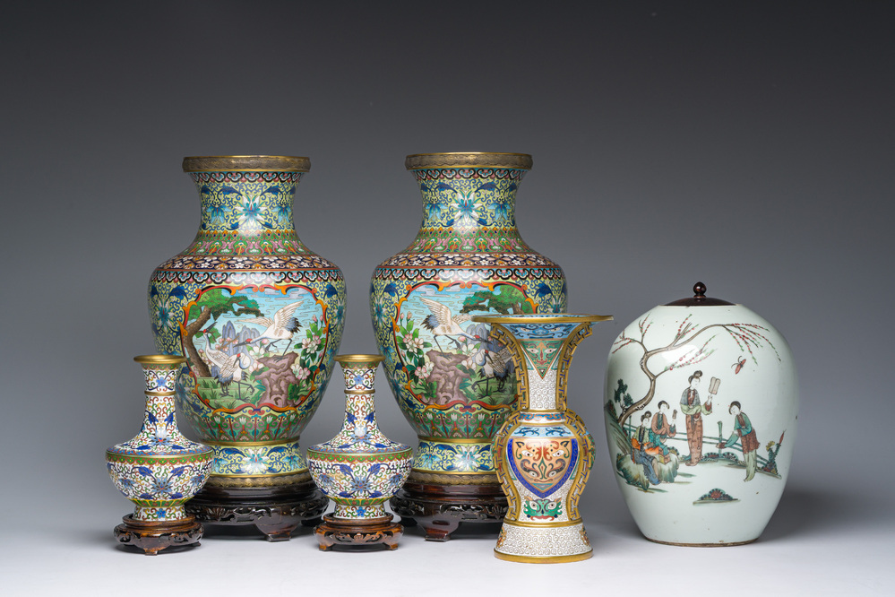 Five Chinese cloisonn&eacute; vases with cranes, taotie masks and floral design and a famille rose jar and cover, 19th/20th C.