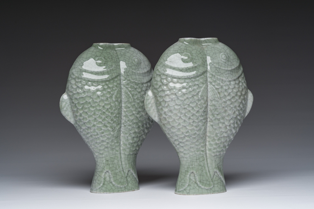 A pair of Chinese celadon glazed 'twin fish' vases, 19th/20th C.