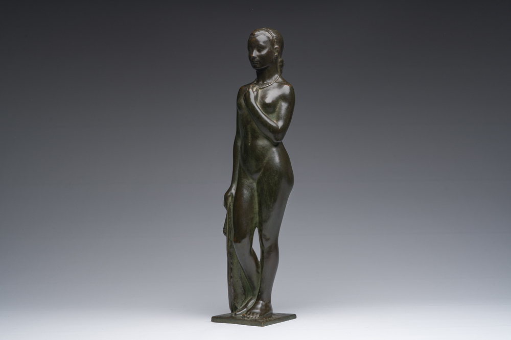 Andr&eacute; Taeckens (1906-1965): Femme nue debout portant un collier, bronze patin&eacute;, marque de fonderie 'Brons G. Vindevogel'