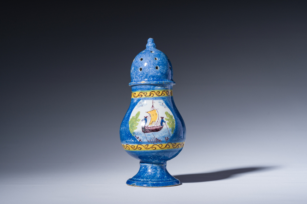 A polychrome Brussels faience caster with an animated river landscape, 18th C.