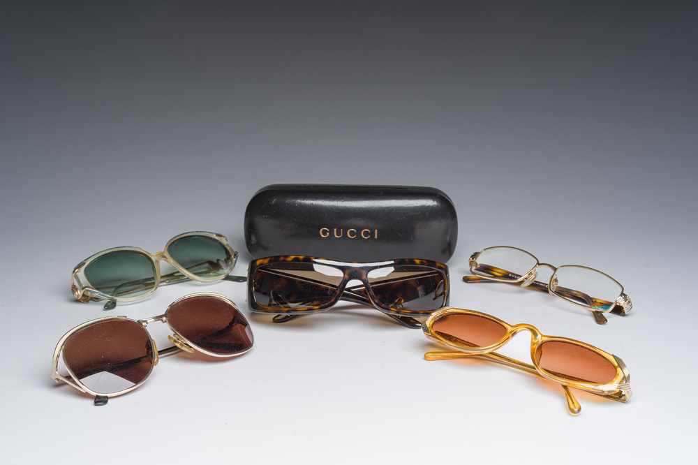 Four various sunglasses and a pair of reading glasses, Bulgari, Christian Dior, Gucci and Yves Saint Laurent, 20th C.