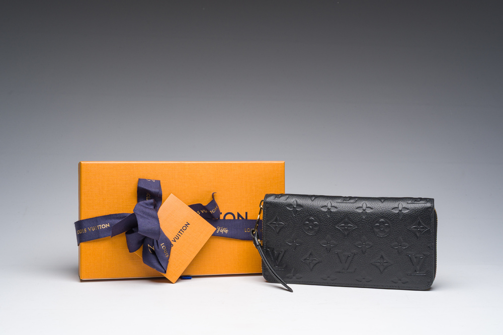 A black leather Louis Vuitton 'Cl&eacute;mence Wallet' with the original packaging, 21st C.