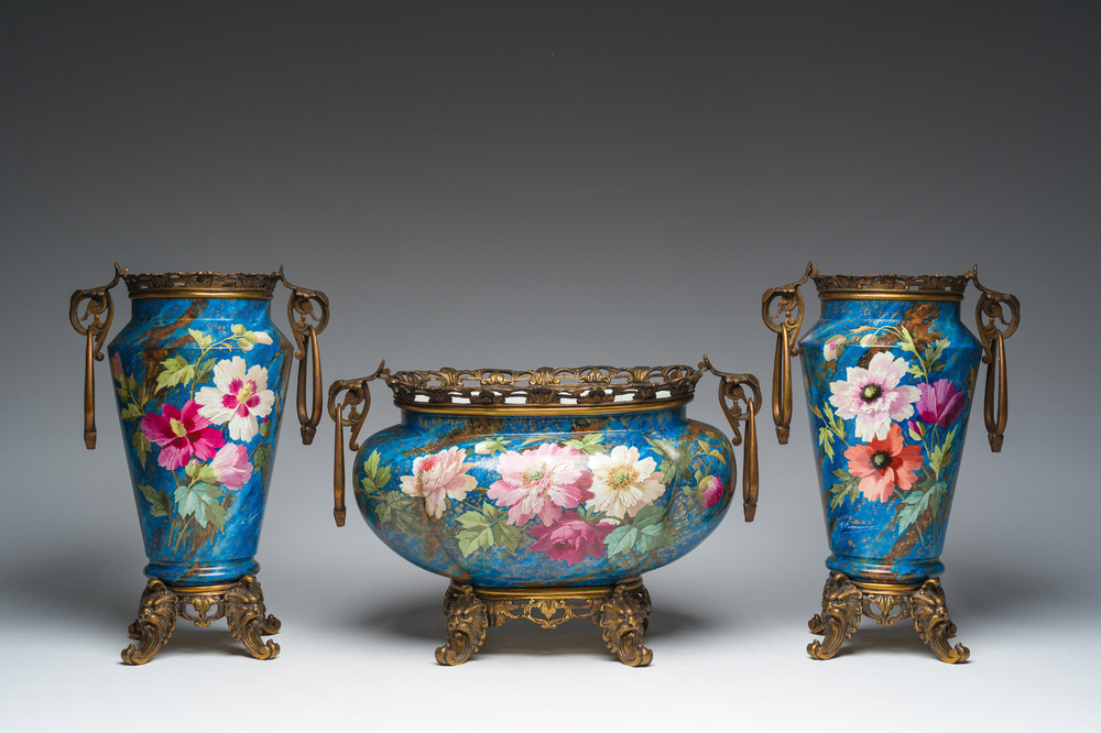 A French three-piece polychrome faience fine bronze mounted garniture with floral design, Creil Montereau Boulenger et Cie, 19th C.